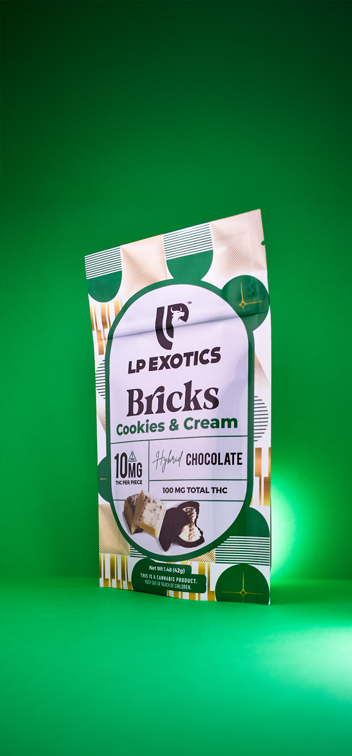 LP Create Bricks Cookies and Cream packaging photographed against a green studio backdrop